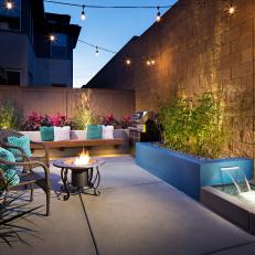 Backyard With String Lights and Blue Block Planter