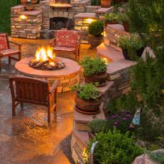 Stone Fire Place and Fire Pit in Backyard Oasis