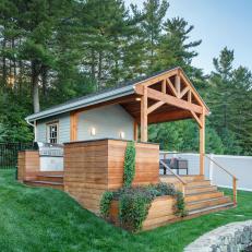 Poolhouse With Covered Cedar Deck Includes Outdoor Kitchen