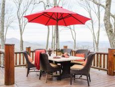 Perched 2,600 feet above the Blue Ridge Mountains, the multi-tiered deck of Ron and Jane Bladon’s mountain house allows them to entertain friends and family outdoors with a breathtaking view and comfortable seating.