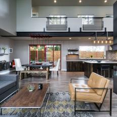 Industrial Style Great Room Features Softening Elements like Color, Fabrics