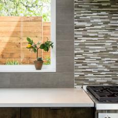 Earth-Toned Backsplash Ties Together Kitchen Color Palette