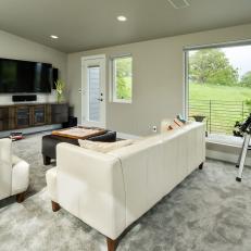 Family Room With Leather Sofa, Picture Window and Telescope