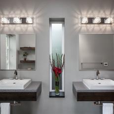 Sleek, Modern Bathroom Features Dual Sinks and Shallow Floating Vanities