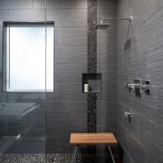 Black Shower With Rain Showerhead and River Rock Detail