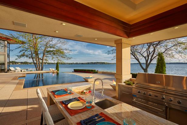 Modern Outdoor Kitchen With Stainless Steel Grill and Marble Bar Dining 