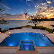 Lakeside Patio Swimming Pool With Negative Edge, Fire Pit Accents and Underwater Lighting 