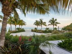 A previously neglected landscape was transformed into a tropical oasis for this beachside resort in Islamorada, Fla. Lush plants surround a swimming pool, oceanfront fire pit, and numerous private seating areas.
