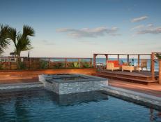 Gray Mosaic Tile Pool and Hot Tub With a Tropical Beach View