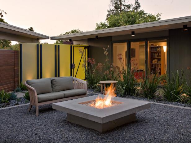 Mid-century Modern Courtyard with Sliding Gate and Fire Pit