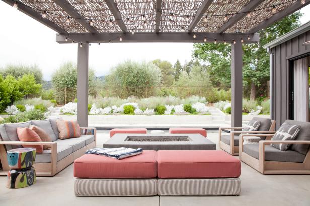 Gray Pergola With String Lights Over Fire Pit