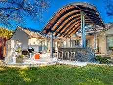 Outdoor Living Room with Modern Steel Pavilion Over Outdoor Kitchen 