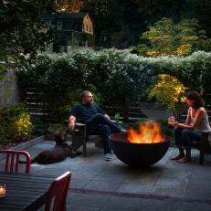 Private Backyard Terrace Features Sleek Fire Bowl