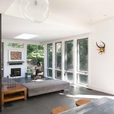 Modern Great Room With Floor-to-Ceiling Windows and Gray Sofa