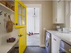 Modern Farmhouse Laundry Room with Yellow Door