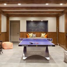 Cozy Game Room With Wood Beams and Wainscoting 