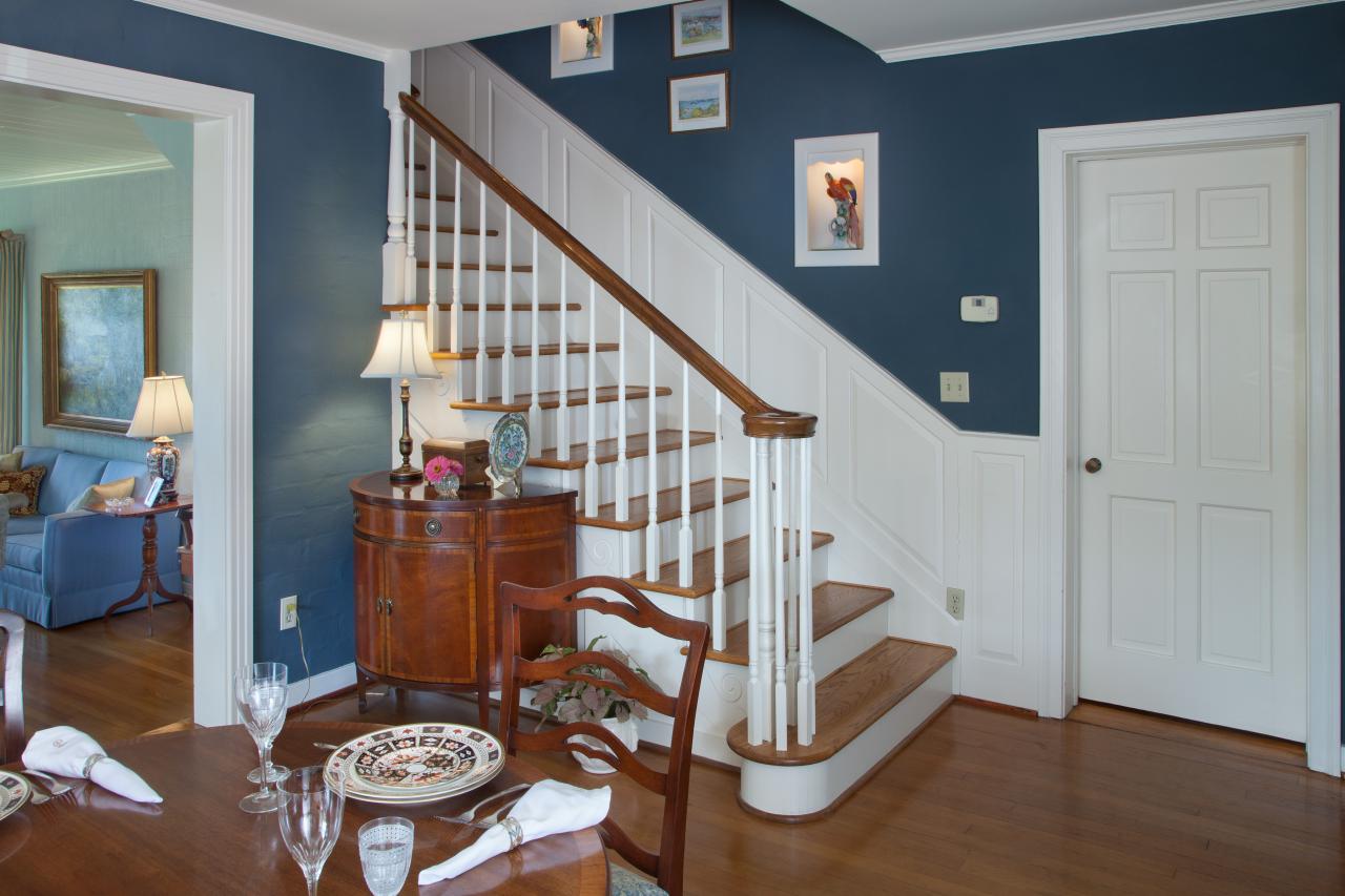 Traditional Formal Dining Room With Blue Walls Built In Shelves