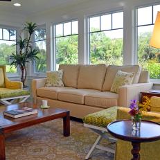 Bright Sunroom Features Yellows & Green In Pattern & Seating