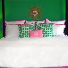 Green Master Bedroom with Bright White Bedding and Colorful Accents
