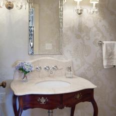 Powder Room Features Antique Vanity, Crystal Sconces & Damask Wallpaper
