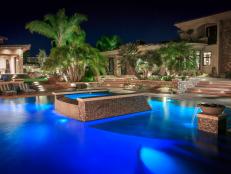 Luxurious Tropical Swimming Pool With In-Pool Tile, Water Features and Palm Trees