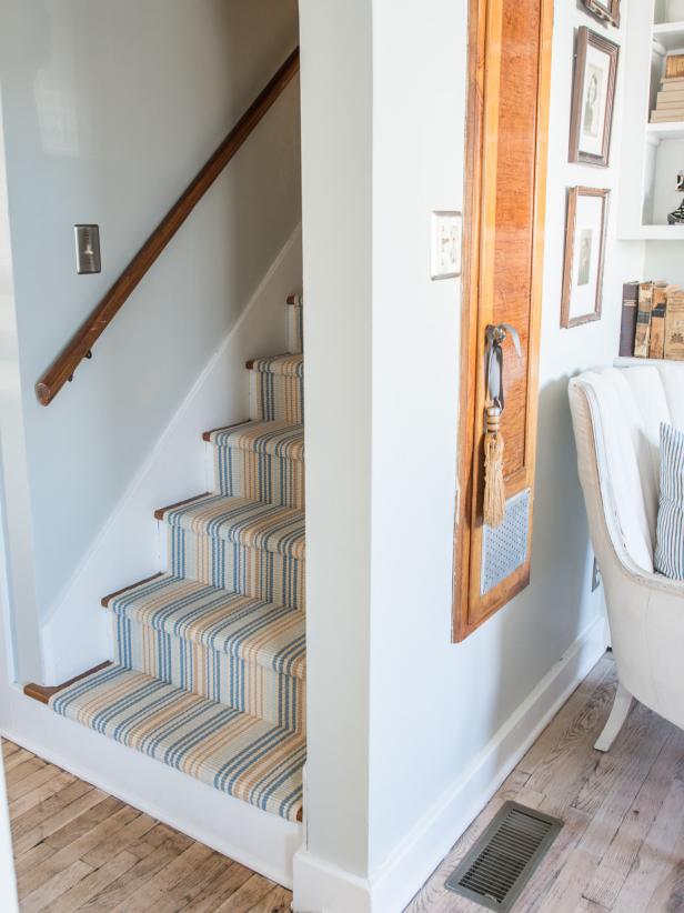 Wooden steps are beautiful, but they can be slippery and cold on the feet. Add some warmth, softness and something for the feet to grip by installing a stair runner.