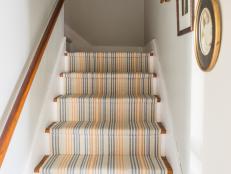 Wooden steps are beautiful but can be slippery and cold underfoot. Add warmth, softness and safety by installing a stair runner. Using inexpensive woven table runners, this project is a snap to do yourself. 