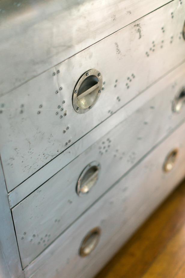 Closeup of Round Drawer Pulls on Textured Metal Chest