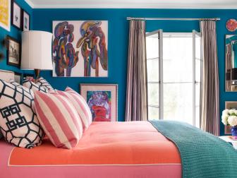 Blue Bedroom With Abstract Art, Gallery Wall and Coral Accents