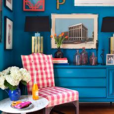 Sitting Area With Gingham Chair, Blue Wall, and Blue Dresser