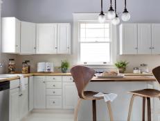Traditional White Kitchen With Wood Midcentury Modern Chairs