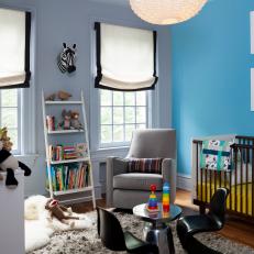 Contemporary Gender-Neutral Nursery with Baby Blue Accent Wall 