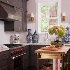 Transitional Kitchen With Metal-Accented Island Cart