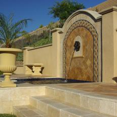 Olympic Gold Travertine Reflects the Light of Day in Backyard Water Feature