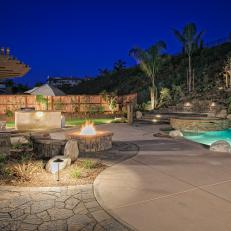 Backyard Space Equipped with Pool, Barbecue Station, Fire Pit and Seating