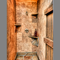 Tropical Shower Features Stone Tile Walls and Flagstone Floor and Shelves