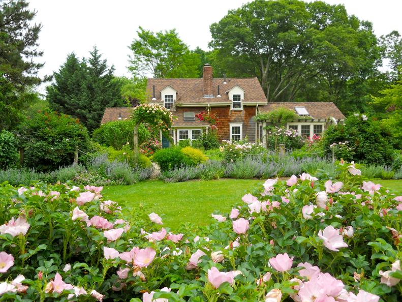 A formal cottage garden with a large lawn