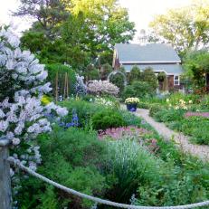 A Gravel Pathway Through a Formal Cottage Garden