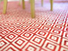 Closeup of Red-and-White Area Rug With Diamond Pattern