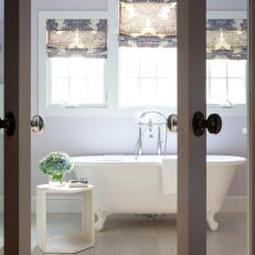 French Doors Lead to Purple Transitional Bathroom