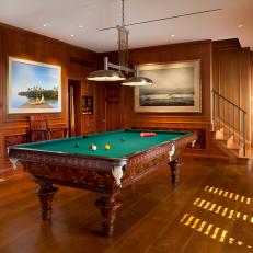 Wood Paneled Game Room With Pool Table