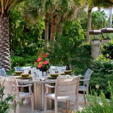 Outdoor Dining Table Under Palm Trees