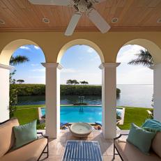 Lavish Covered Patio With Swimming Pool View, Open Archways and Cushioned Benches 