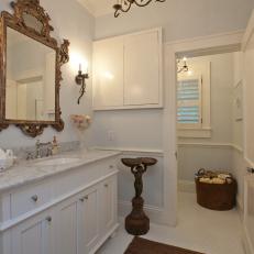 Traditional, Bright Bathroom With Victorian Mirror Frame and Subtle Pastel Wall Color 
