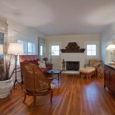 Traditional Living Room With Victorian Influence Featuring High-Backed Seating and Grand Mantel Decor