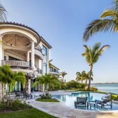 Waterfront Home With Spacious Swimming Pool Patio and Tropical Palms 