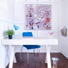 Bright White Home Office With Modern Painting and Bold Blue Chair