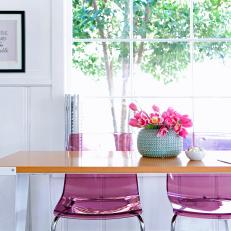 Light and Bright Home Office With Pink Acrylic Chairs