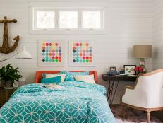 The color aqua inspires the design in this trendy guest bedroom and bathroom, where comfort and style invite overnight visitors to unwind.