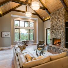 Neutral Rustic Living Room With Wood Ceiling